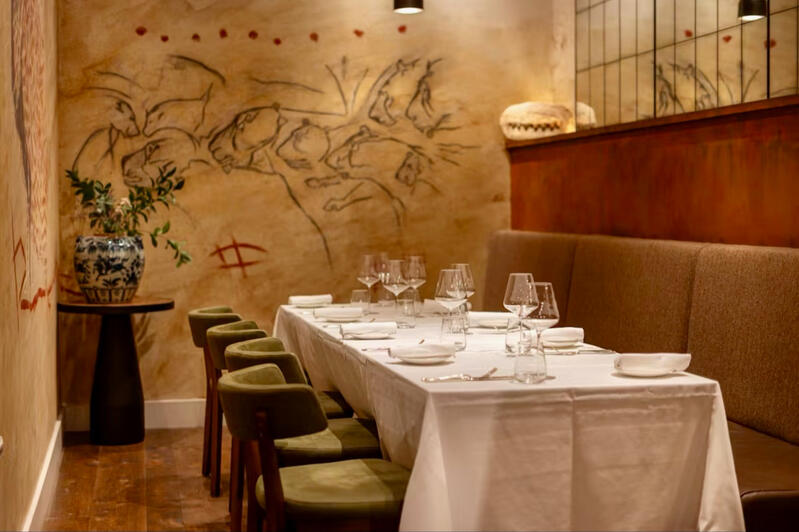 Cave art &amp; rust wall - Origin City restaurant, London